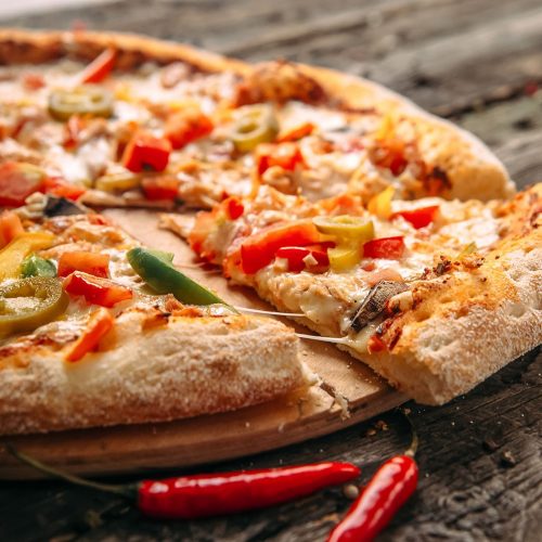 Closeup on appetizing pepper pizza with jalapeno, horizontal